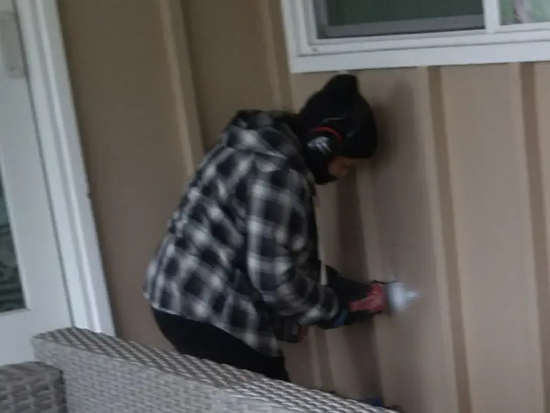 Professional electrician installing an exterior outlet in Bluffton